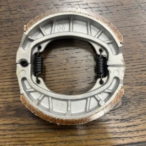 THE REAR BRAKE SHOE BLOCK